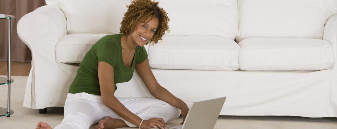 woman working on laptop on floor