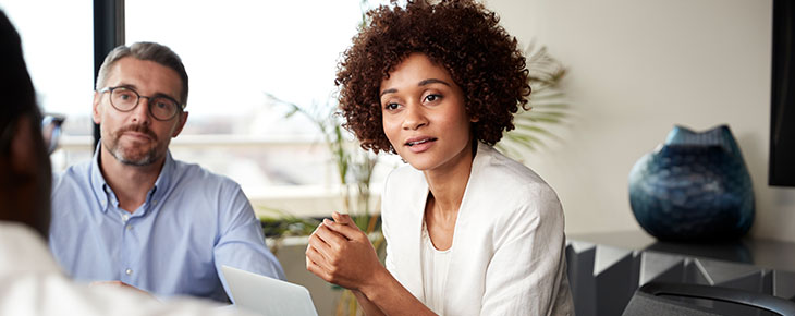 Woman conducting a meeting in a conference room