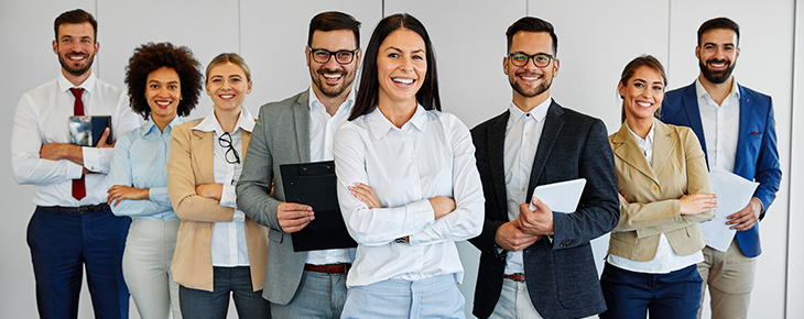 Group of business professionals standing together.