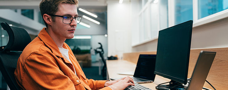 Young programmers working on a new project for a start up business.