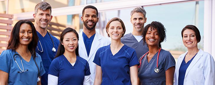 Group of nurses and doctors standing together.