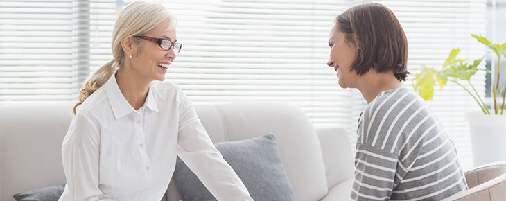 Two women in discussion in a theraputic setting