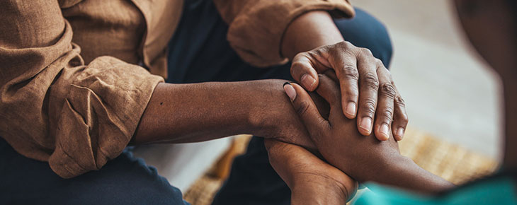 Closeup of supporting hands