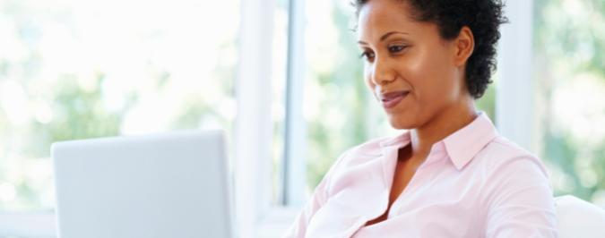 woman typing on laptop