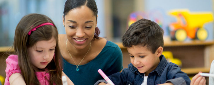 Teacher and student filling in a coloring book
